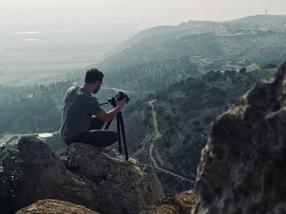 Portrait of a Danish photographer holding a camera